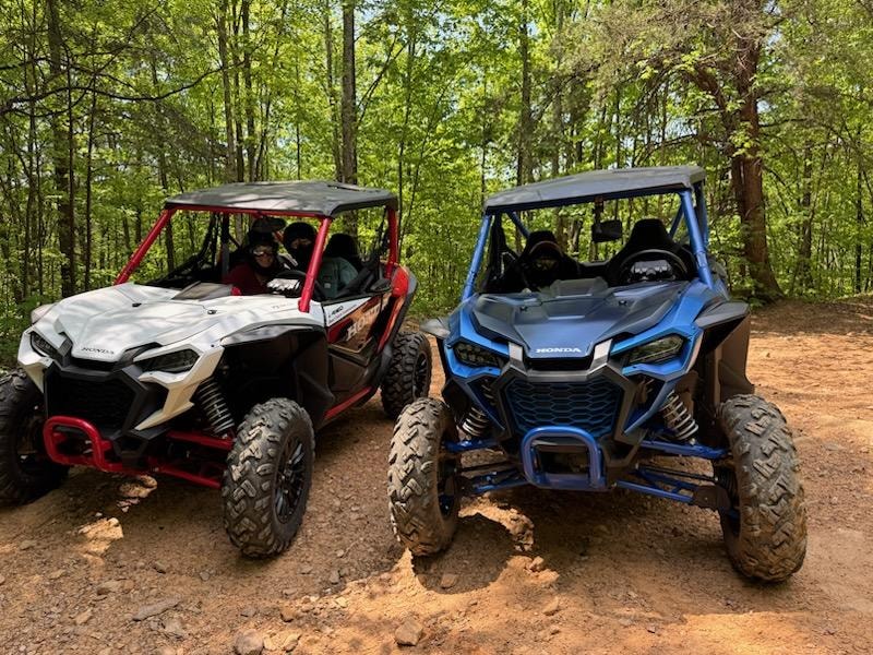 Off-road UTV on muddy forest trail